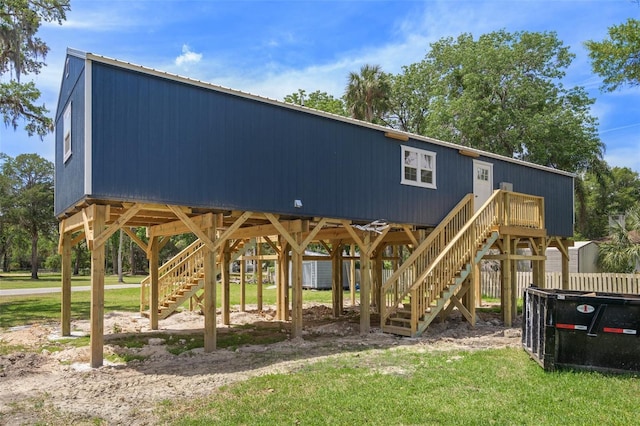 view of property's community featuring stairs and a yard