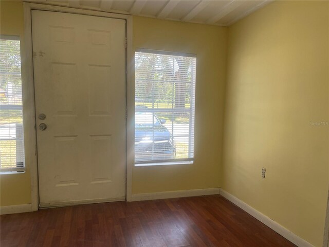 621 NE 20th St, Ocala, FL 34470 - entryway with dark wood-type flooring and baseboards