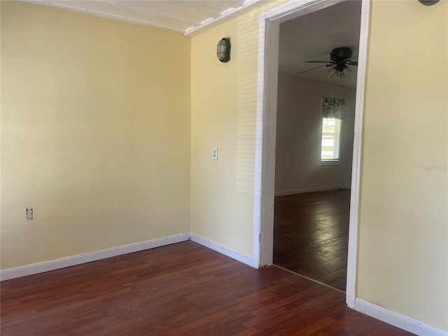 621 NE 20th St, Ocala, FL 34470 - unfurnished room featuring ceiling fan, baseboards, and dark wood finished floors