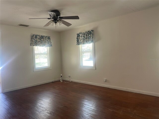 621 NE 20th St, Ocala, FL 34470 - unfurnished room featuring plenty of natural light, hardwood / wood-style flooring, and baseboards