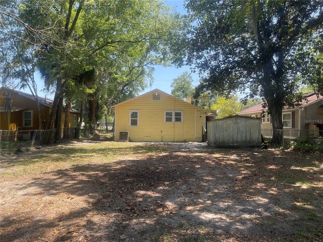 621 NE 20th St, Ocala, FL 34470 - rear view of house featuring cooling unit