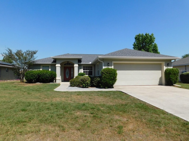 single story home featuring stucco siding, a front yard, concrete driveway, and an attached garage