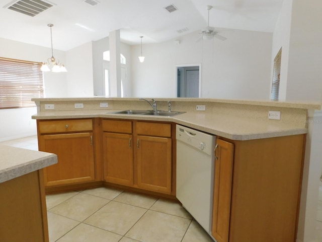 kitchen featuring light countertops, dishwasher, a sink, and visible vents