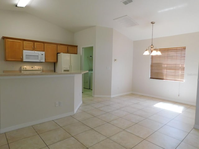 kitchen with lofted ceiling, an inviting chandelier, white appliances, and light countertops