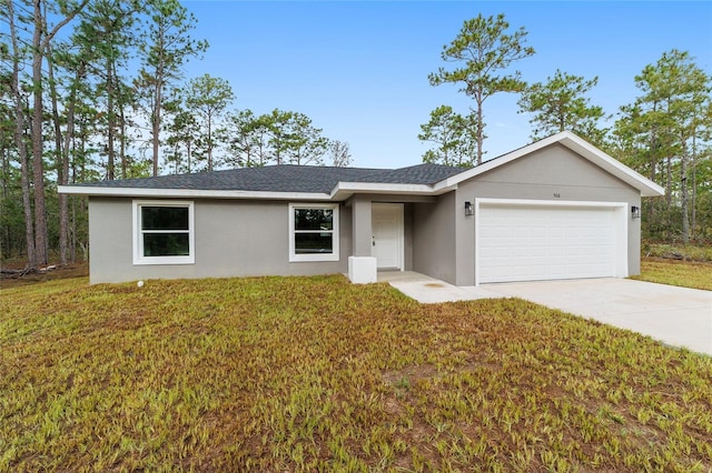 ranch-style home with driveway, roof with shingles, a front yard, an attached garage, and stucco siding