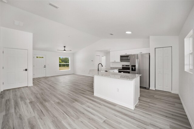 kitchen with white cabinets, appliances with stainless steel finishes, visible vents, ceiling fan, and vaulted ceiling
