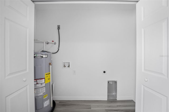 laundry area with hookup for a washing machine, hookup for an electric dryer, wood finished floors, and electric water heater