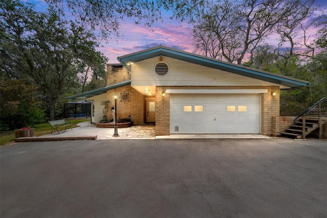 1179 SE 170th Ct, Silver Springs, FL 34488 - view of front of property with driveway, a garage, and stairs