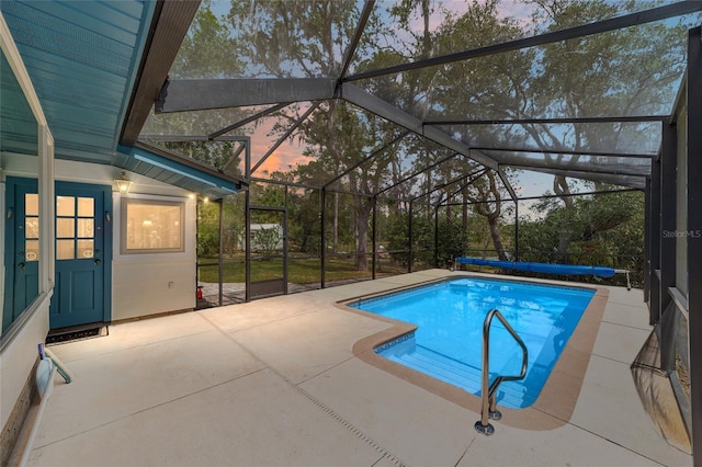 1179 SE 170th Ct, Silver Springs, FL 34488 - pool at dusk featuring an outdoor pool, a patio, and a lanai