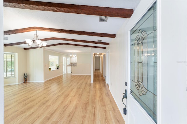 1179 SE 170th Ct, Silver Springs, FL 34488 - entrance foyer with a chandelier and light wood-style flooring