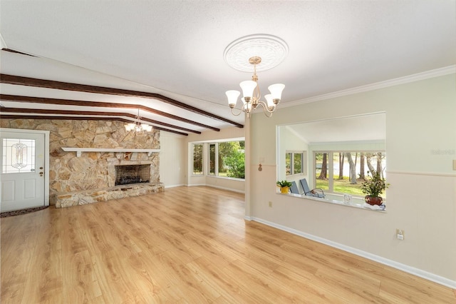 1179 SE 170th Ct, Silver Springs, FL 34488 - unfurnished living room with a chandelier, wood finished floors, and a fireplace