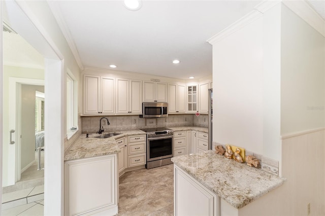 1179 SE 170th Ct, Silver Springs, FL 34488 - kitchen with stainless steel appliances, light stone countertops, glass insert cabinets, decorative backsplash, and recessed lighting