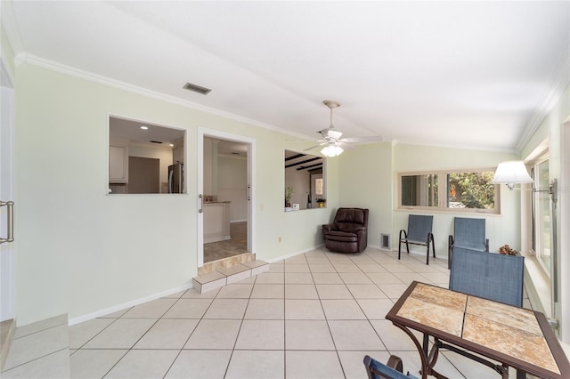 1179 SE 170th Ct, Silver Springs, FL 34488 - living room featuring crown molding, a ceiling fan, light tile patterned floors, and vaulted ceiling