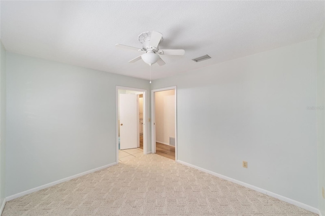 1179 SE 170th Ct, Silver Springs, FL 34488 - empty room with light carpet and a ceiling fan