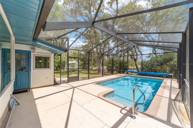 1179 SE 170th Ct, Silver Springs, FL 34488 - view of swimming pool featuring a covered pool, a patio area, and glass enclosure