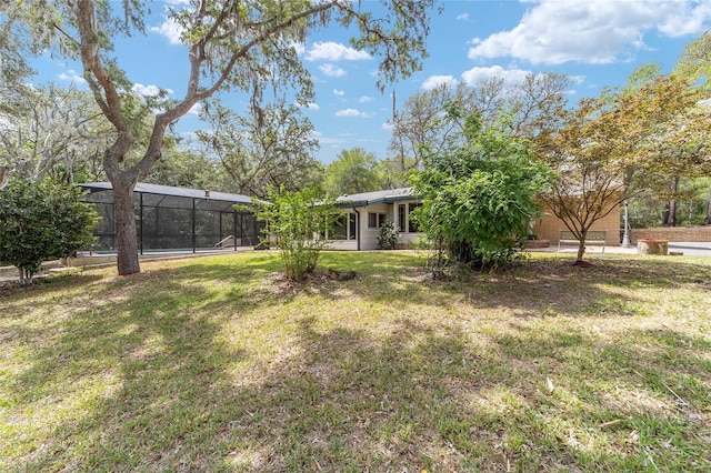 1179 SE 170th Ct, Silver Springs, FL 34488 - view of grassy yard with glass enclosure