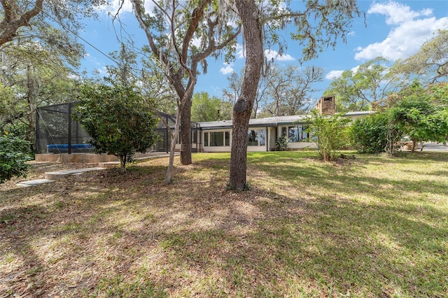 1179 SE 170th Ct, Silver Springs, FL 34488 - view of grassy yard with glass enclosure