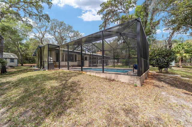 1179 SE 170th Ct, Silver Springs, FL 34488 - rear view of property featuring an outdoor pool and a lawn
