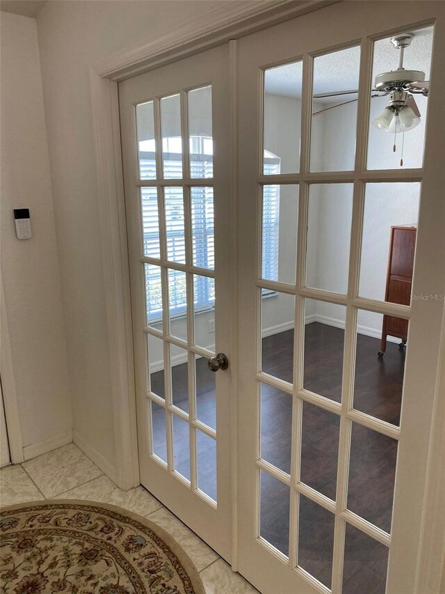 15266 SW 44th Ter, Ocala, FL 34473 - doorway to outside with baseboards, ceiling fan, french doors, and light tile patterned floors
