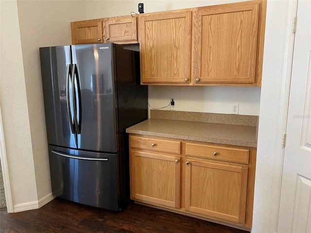 15266 SW 44th Ter, Ocala, FL 34473 - kitchen featuring baseboards, freestanding refrigerator, dark wood-style flooring, and light countertops