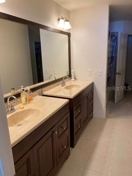 15266 SW 44th Ter, Ocala, FL 34473 - full bathroom with vanity and tile patterned floors