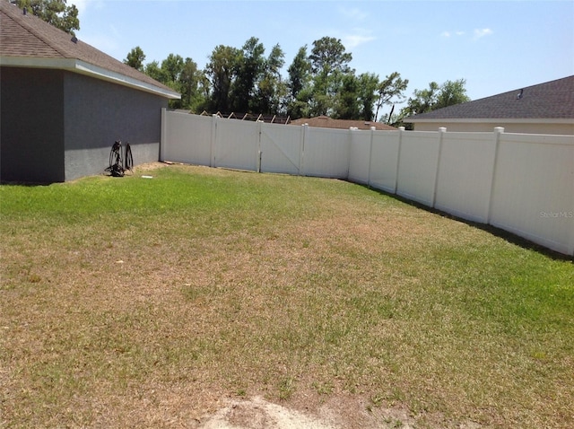 15266 SW 44th Ter, Ocala, FL 34473 - view of yard featuring a fenced backyard and a gate