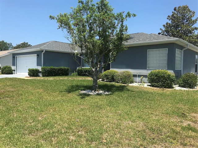 11411 SW 138th Ln, Dunnellon, FL 34432 - single story home featuring roof with shingles, an attached garage, stucco siding, and a front lawn