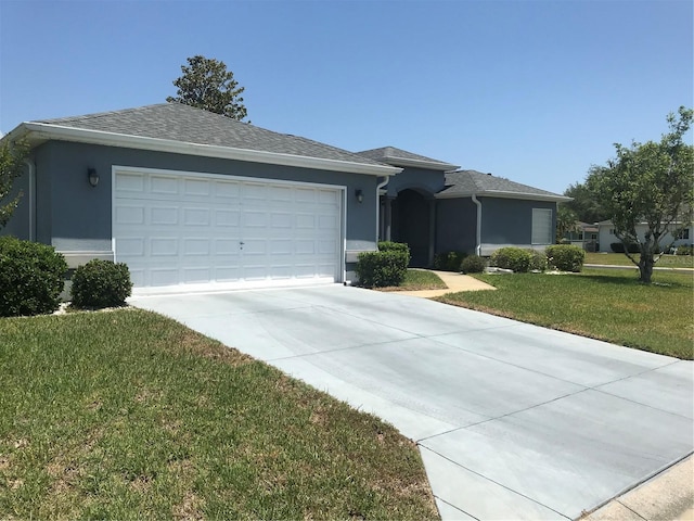 11411 SW 138th Ln, Dunnellon, FL 34432 - ranch-style house with a garage, a front lawn, stucco siding, a shingled roof, and driveway
