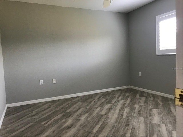 11411 SW 138th Ln, Dunnellon, FL 34432 - unfurnished room with baseboards, dark wood-style flooring, and ceiling fan