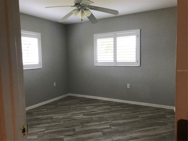 11411 SW 138th Ln, Dunnellon, FL 34432 - empty room with baseboards, ceiling fan, and dark wood-style flooring