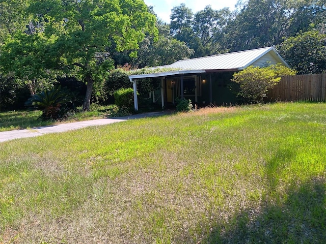 2510 NE 167th Ave, Williston, FL 32696 - view of outdoor structure with fence, driveway, and an attached carport