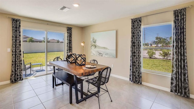 dining room with light tile patterned floors, recessed lighting, visible vents, and baseboards