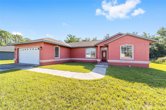 15087 SW 43rd Ct, Ocala, FL 34473 - ranch-style home featuring an attached garage, a front yard, asphalt driveway, and stucco siding