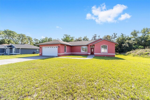 15087 SW 43rd Ct, Ocala, FL 34473 - single story home featuring driveway, an attached garage, a front lawn, and stucco siding
