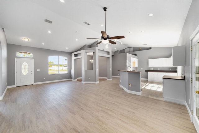 15087 SW 43rd Ct, Ocala, FL 34473 - unfurnished living room with a ceiling fan, lofted ceiling, a sink, baseboards, and recessed lighting