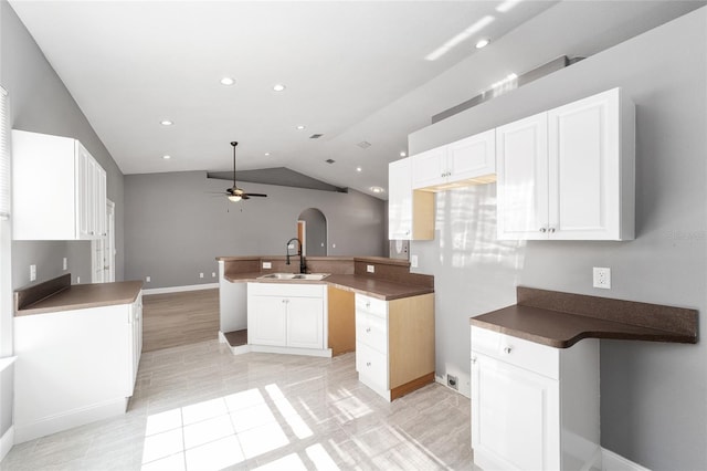 15087 SW 43rd Ct, Ocala, FL 34473 - kitchen with a ceiling fan, a sink, vaulted ceiling, white cabinetry, and recessed lighting