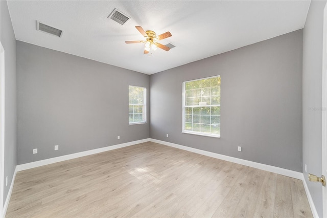15087 SW 43rd Ct, Ocala, FL 34473 - unfurnished room with light wood finished floors, ceiling fan, and baseboards
