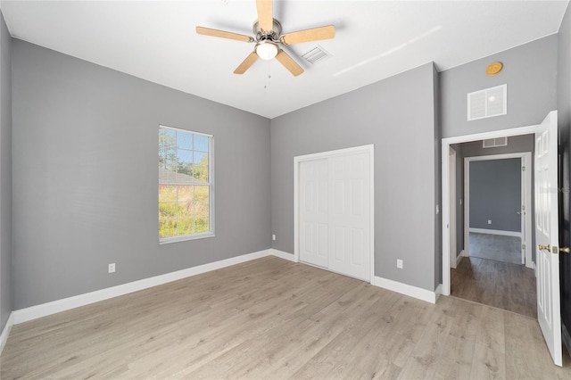 15087 SW 43rd Ct, Ocala, FL 34473 - unfurnished bedroom with light wood-type flooring, a closet, baseboards, and a ceiling fan