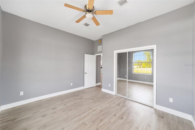 15087 SW 43rd Ct, Ocala, FL 34473 - unfurnished bedroom with light wood-style floors, baseboards, a closet, and ceiling fan