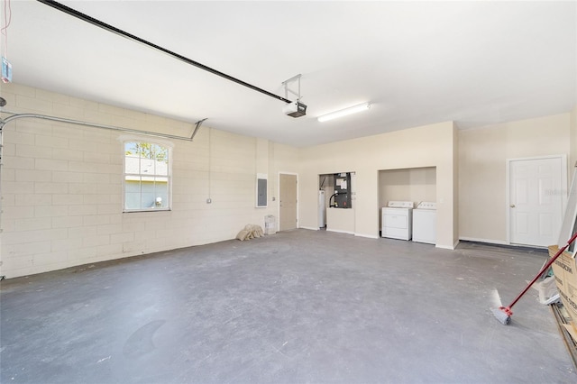 15087 SW 43rd Ct, Ocala, FL 34473 - garage with washing machine and dryer, a garage door opener, and electric panel