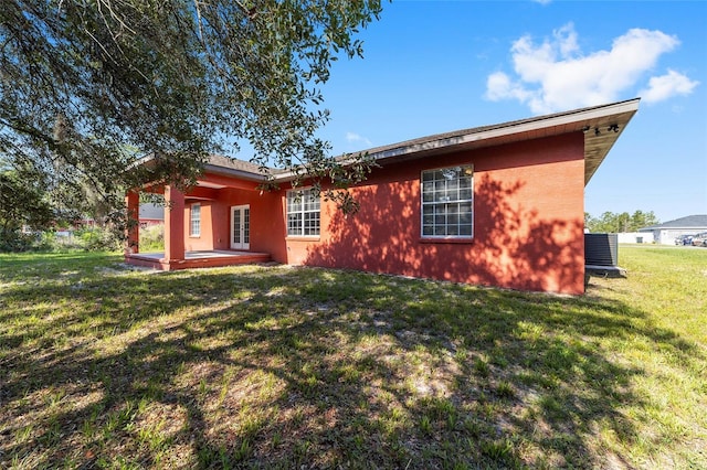 15087 SW 43rd Ct, Ocala, FL 34473 - back of house featuring a patio area and a lawn