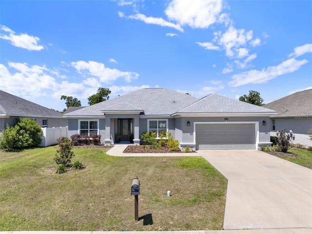 4806 NW 8th Ter, Ocala, FL 34475 - ranch-style home featuring a garage, a front lawn, fence, stucco siding, and concrete driveway