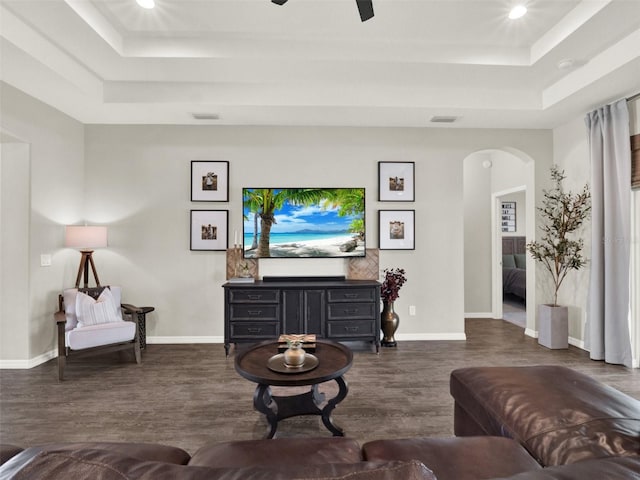 4806 NW 8th Ter, Ocala, FL 34475 - living room featuring visible vents, arched walkways, a raised ceiling, and wood finished floors