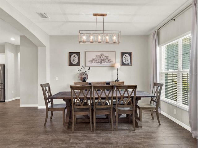 4806 NW 8th Ter, Ocala, FL 34475 - dining room with baseboards, dark wood finished floors, and visible vents
