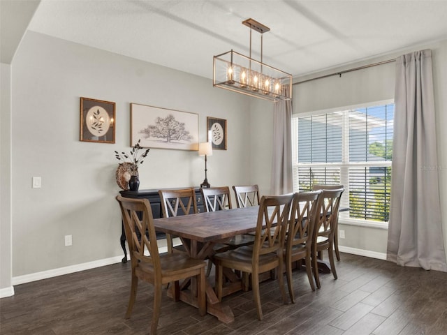 4806 NW 8th Ter, Ocala, FL 34475 - dining area with baseboards, dark wood finished floors, and a chandelier