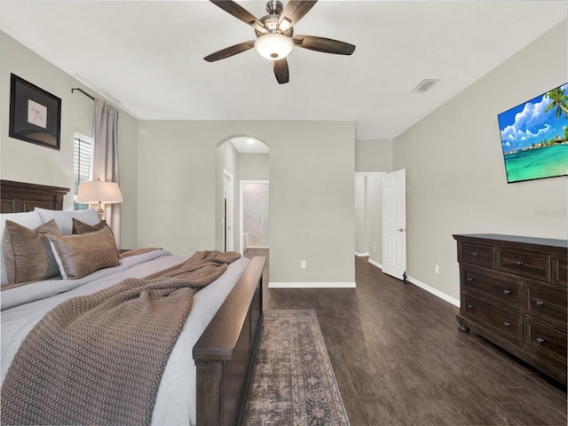 4806 NW 8th Ter, Ocala, FL 34475 - bedroom with a ceiling fan, visible vents, arched walkways, baseboards, and dark wood-type flooring