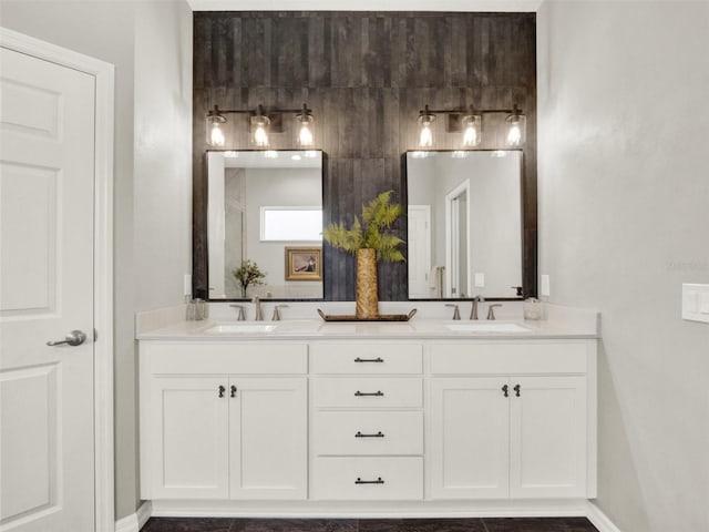 4806 NW 8th Ter, Ocala, FL 34475 - full bath with double vanity, a sink, and baseboards