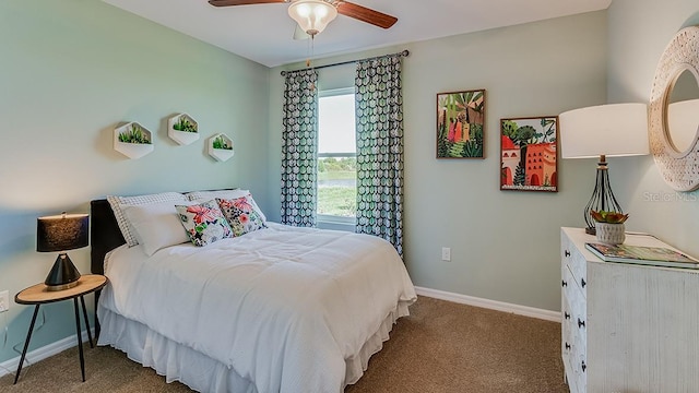 bedroom with a ceiling fan, carpet, and baseboards