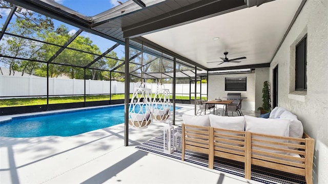 view of swimming pool featuring a lanai, a fenced in pool, a fenced backyard, a patio, and outdoor lounge area