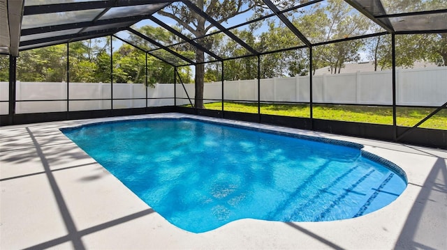 view of swimming pool featuring a fenced in pool, fence, and a lanai